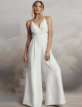 Weißer Jumpsuit mit V-Ausschnitt und Stickerei